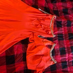 "This elegant orange prom gown, crafted by Angela and Alison, is a size 6